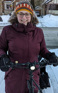 Emma with her bike on a snowy day