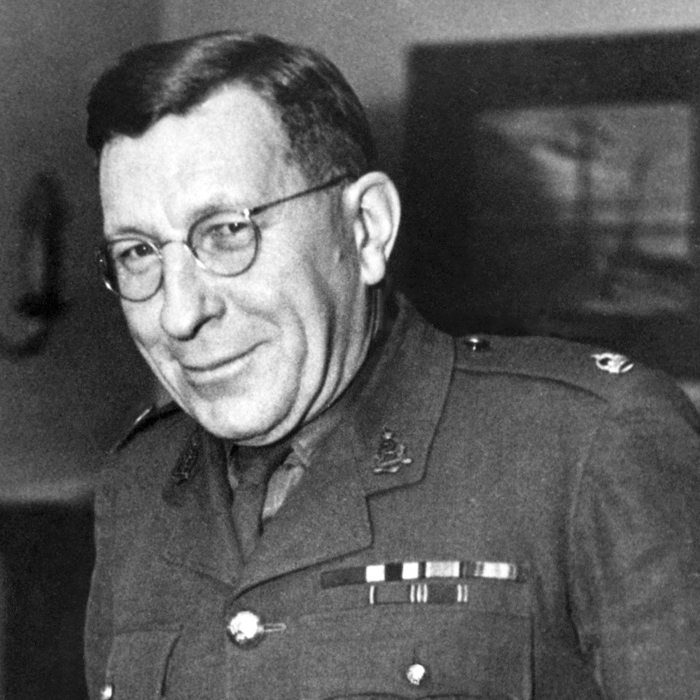 A photograph of Sir Frederick Banting smiling.