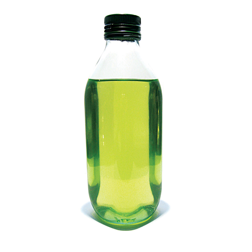 A photograph of an unmarked bottle of green oil.