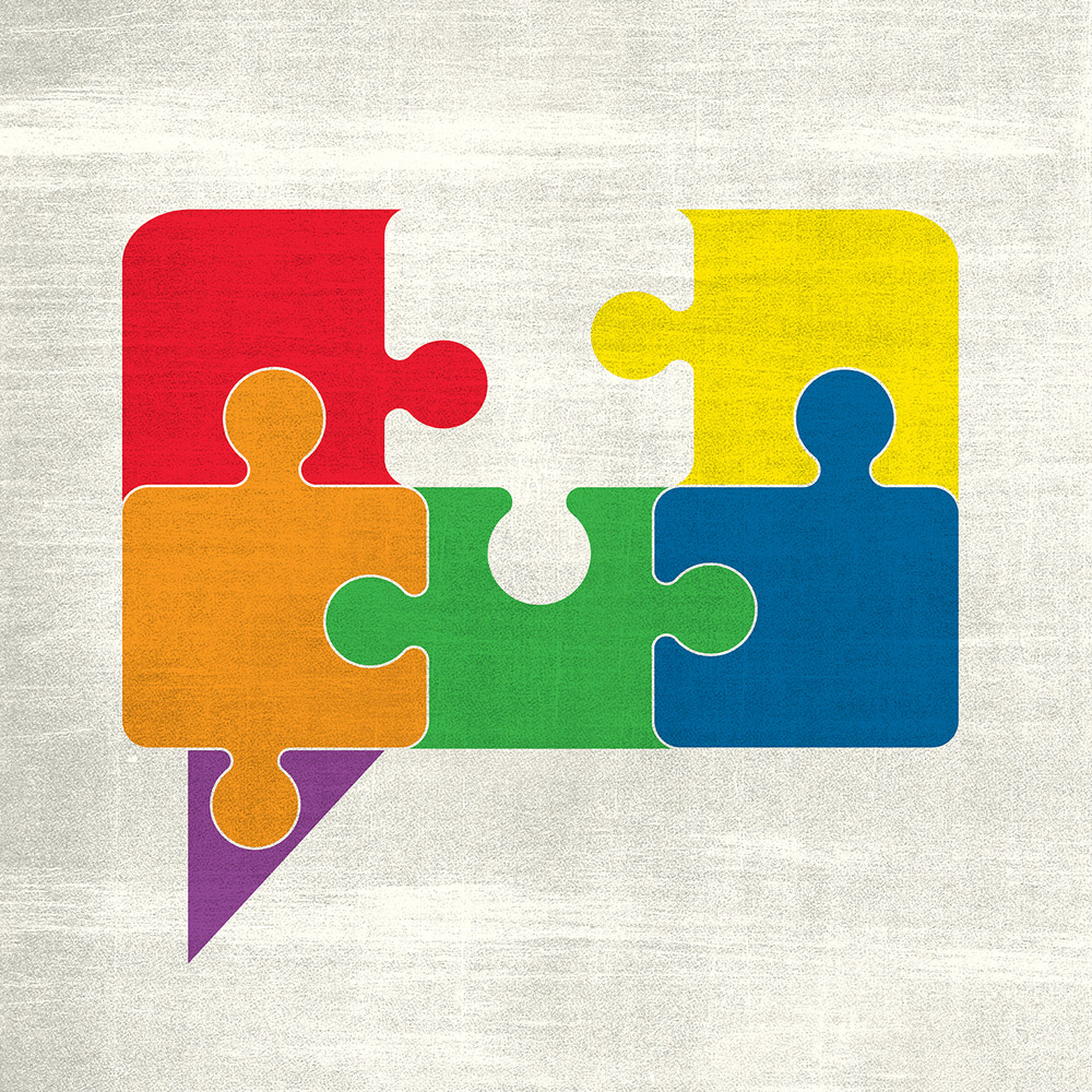 An illustration of six differently-coloured jigsaw puzzle pieces combined in the shape of a speech bubble.