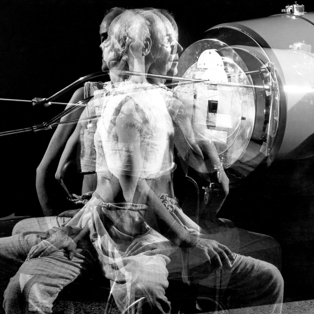 A series of photographs of Dr. Ivan Smith sitting before a scientific machine blended together in various poses.