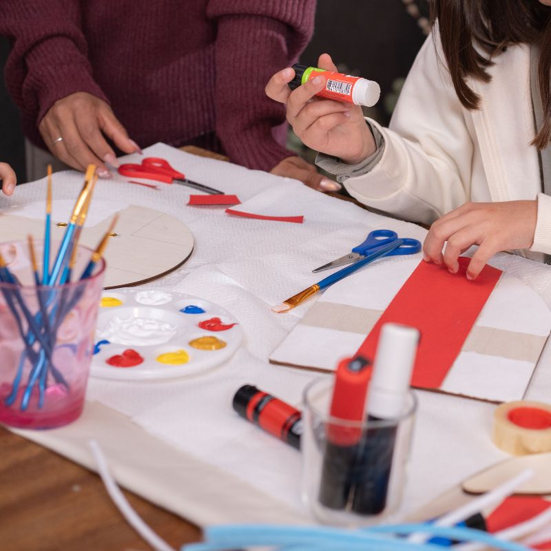Young children running in a gymnasium.