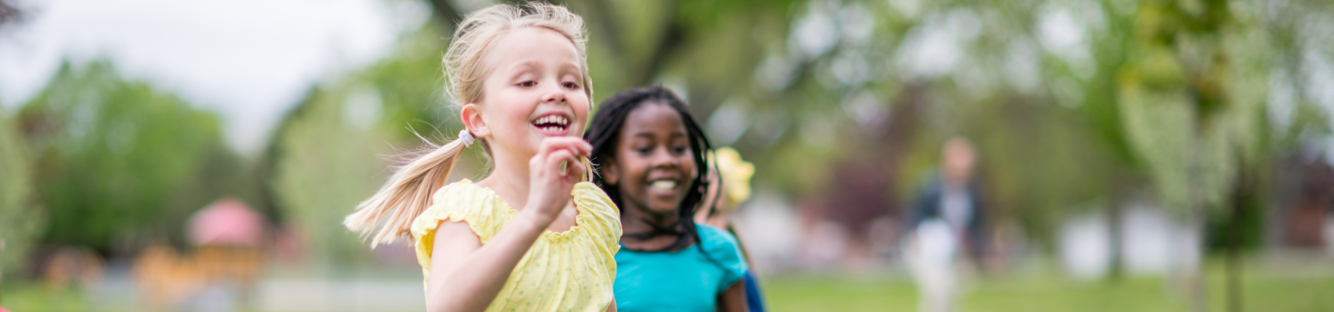 Children running outside in summertime.