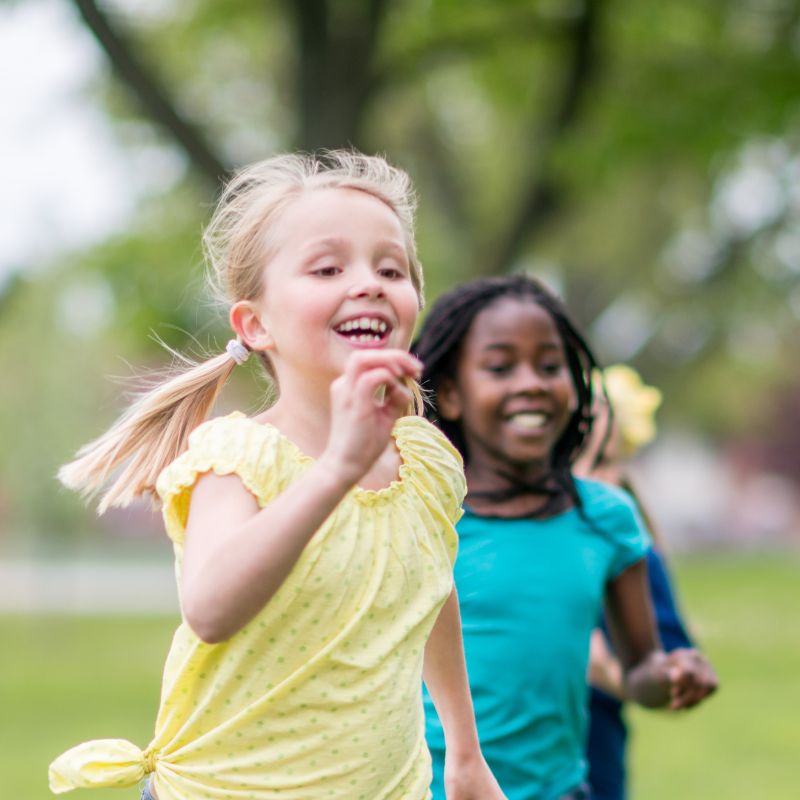 Children running outside in summertime.