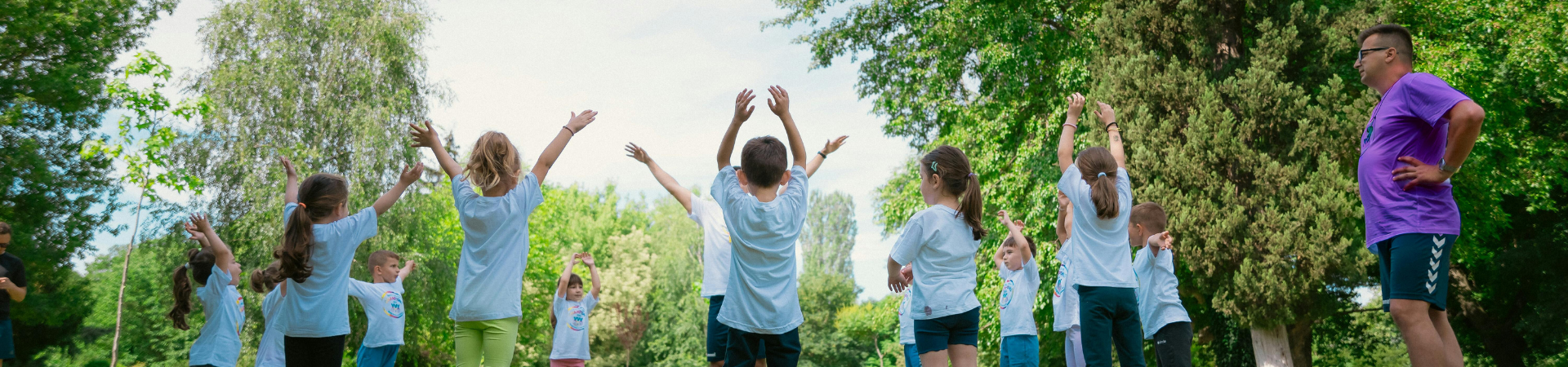 Young children gather for outdoor programming.
