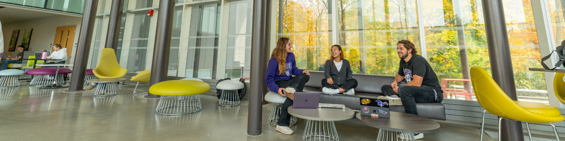Students talking around a table in the WIRB lobby