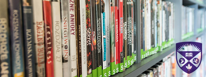 A shelf with a row of DVDs