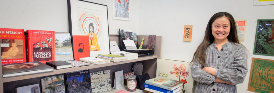 Yan Zhou, Western's curator-in-residence, is eager to connect, engage and develop new ideas with the help of the campus community. She also runs a small library in her office, what she calls her “Diaspora Climate bookshelf." (Christopher Kindratsky/Western Communications)