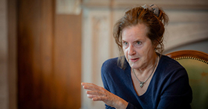 A portrait of journalist Carol Off mid conversation