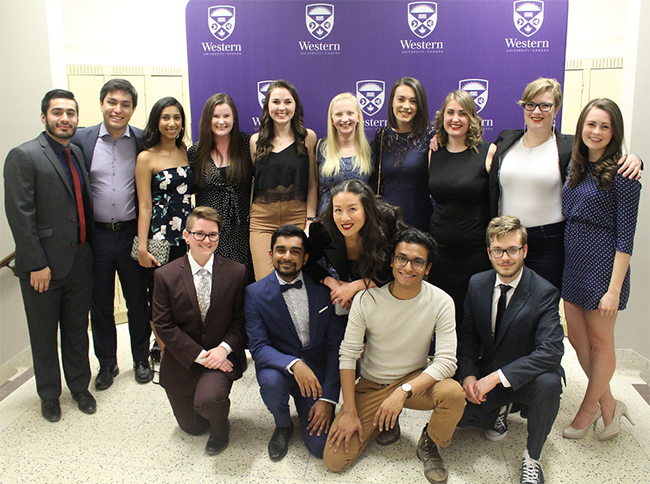 A group of students and an instructor pose for a photograph