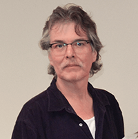 A portrait of Sam Thomas