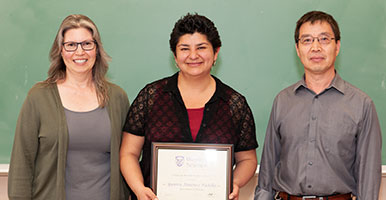 POK this is a photo of one of our Grad Students recieving an award for being the best teaching Assistant in Biology. This link does not lead to this kind of award. Instead it goes to Scholarships and Awards