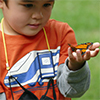 Child holding a monarch butterfly