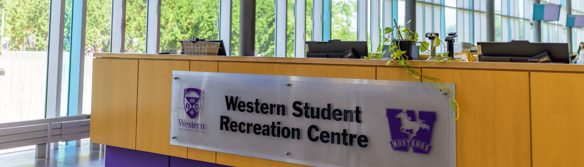 Front desk of western student recreation centre and windows behind it