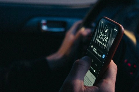 Man texting and driving