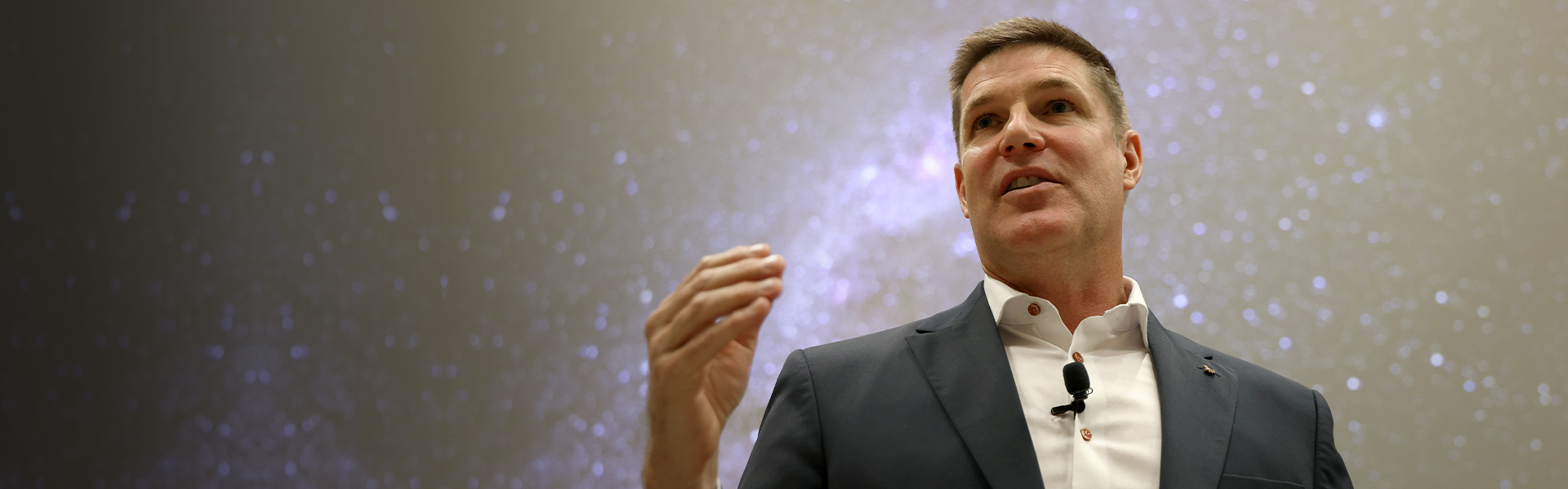 Astronaut Jeremy Hansen speaks to a crowd of Western staff.