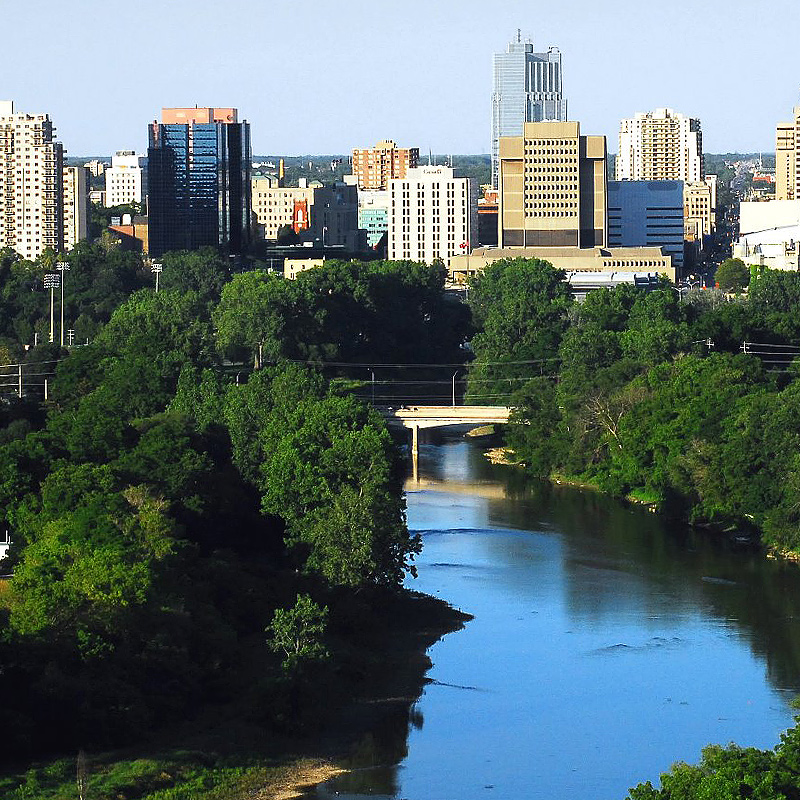 An aerial view of downtown London, Ontario with the river running down the middle.