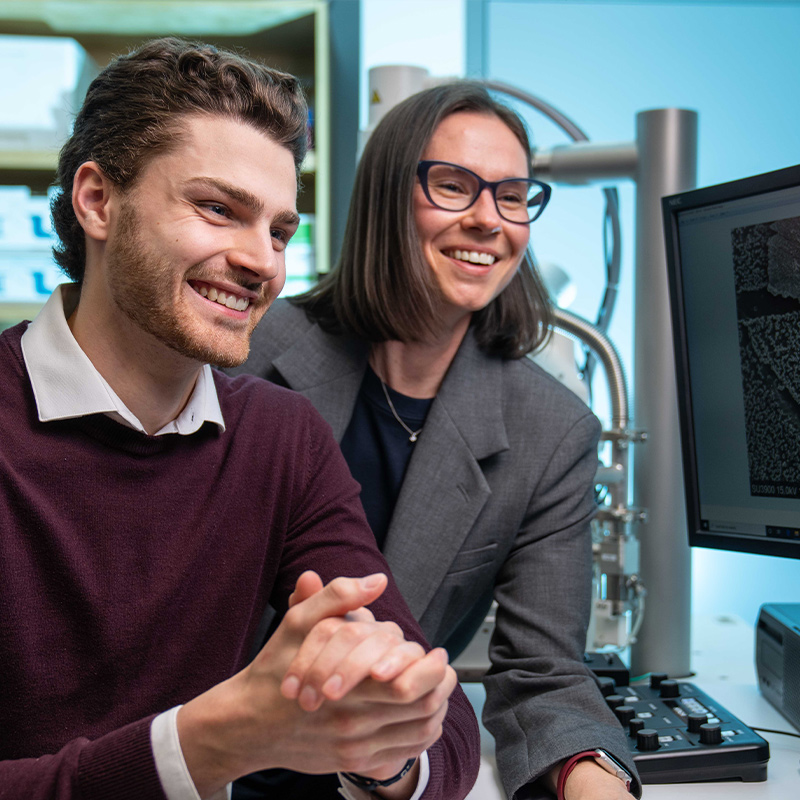 Western researcher works with a graduate student.