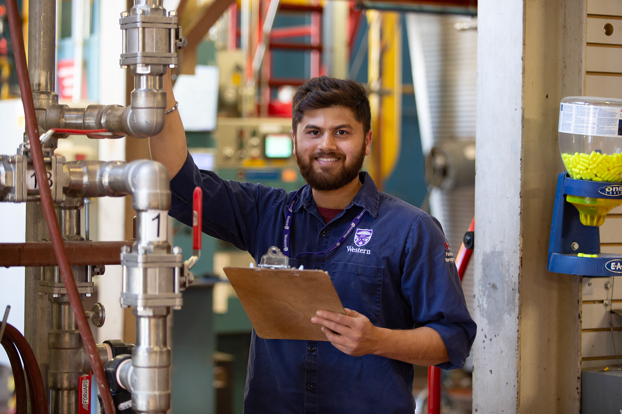 Stationary Engineer, Aman Saini performs maintenance inside Western's Power Plant.