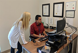 mauricio and marnie on the clinical trials computer.jpg