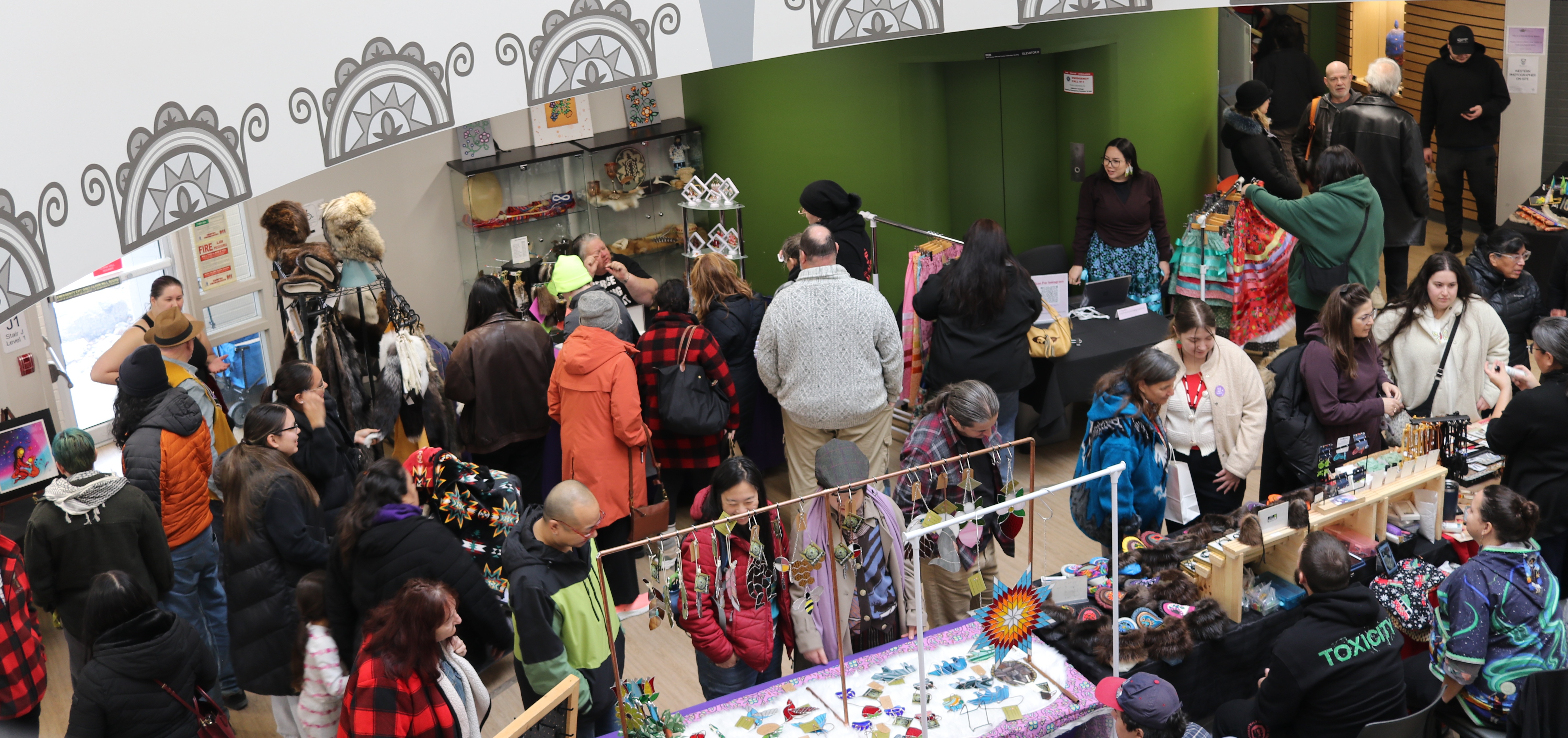 A photo from the mezzanine showing the busy Indigenous Winter Market below.