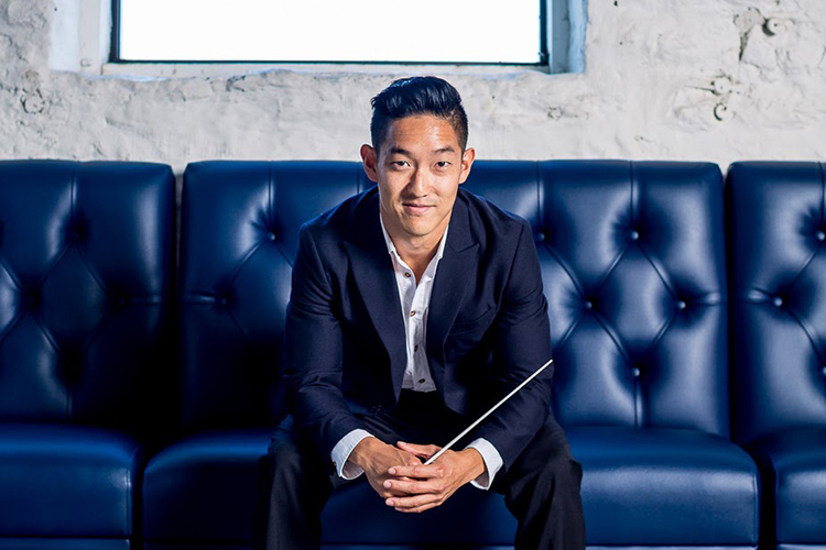 John Yun seated on a couch