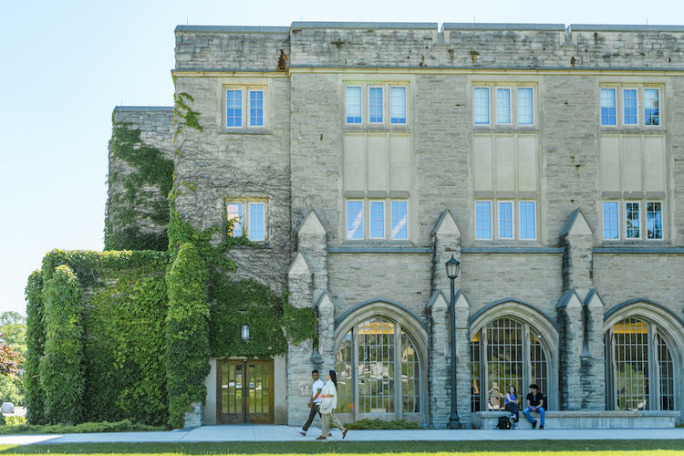 Students walking on Western's campus in the sunshine