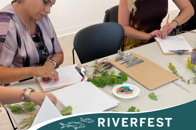 People drawing on paper at a table