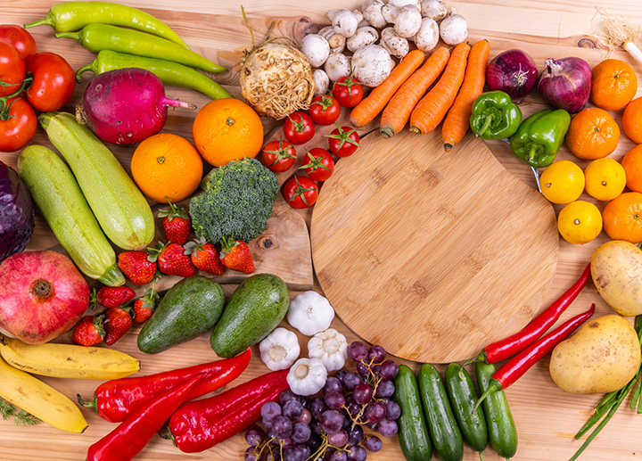 A large variety of fruits and vegetables displayed on a table.