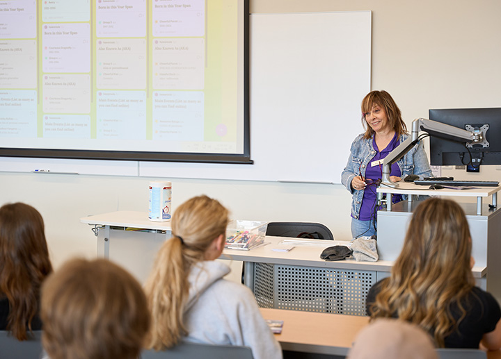 A Family Studies Professor speaking to a room of students.