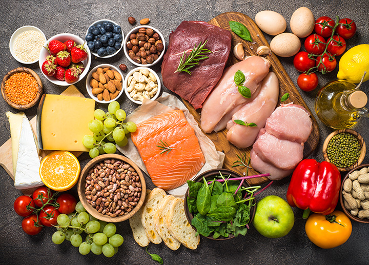 A variety of vegetables and spices arranged on a table.