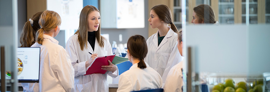 Students in food lab talking to eachother