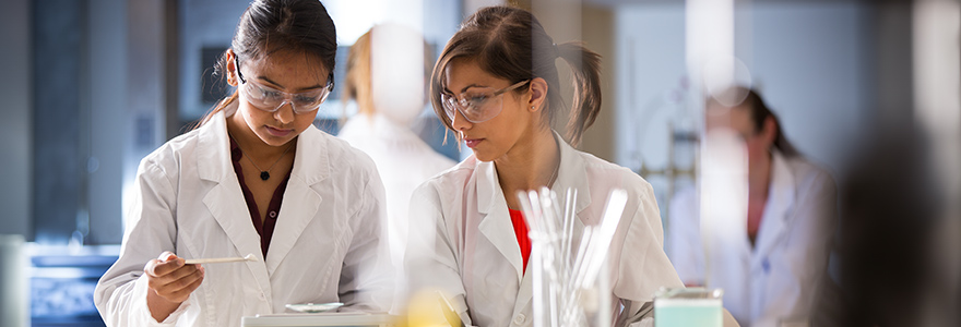 Two students working in lab