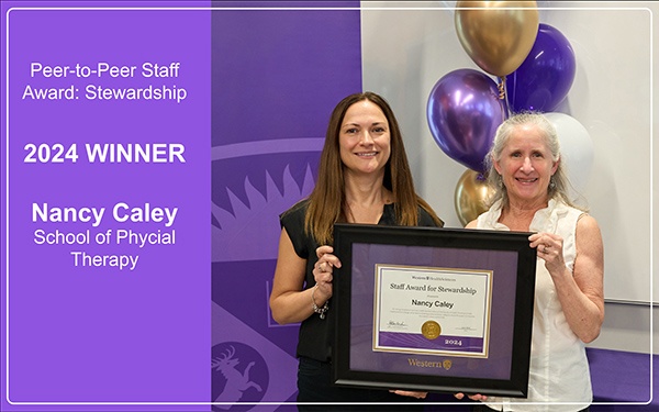 Nancy Caley receives her award from Jayne Garland