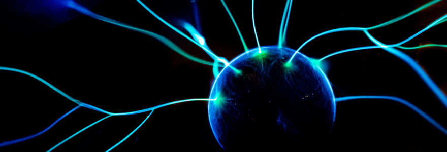 Detail of a blue electrostatic sphere on a dark background