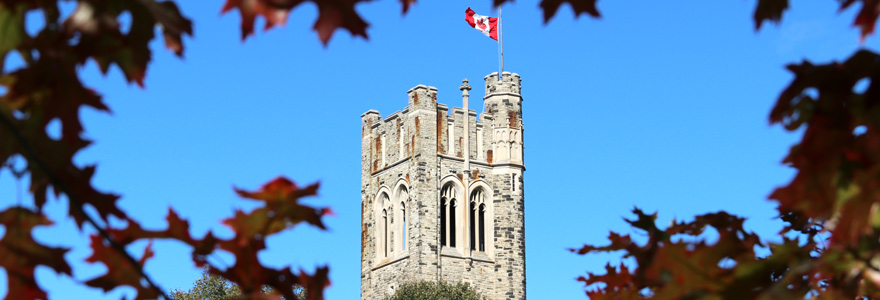 Beauty shot of University College through autumn leaves