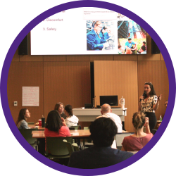 A speaker in a room presenting.