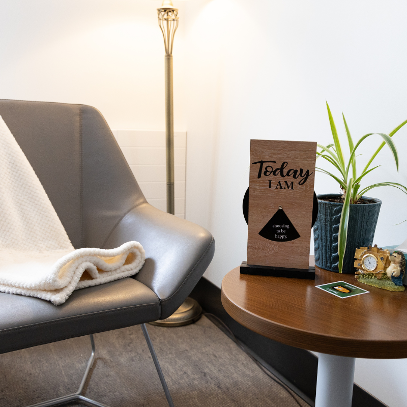 A student and a mental health counsellor sit in an office.