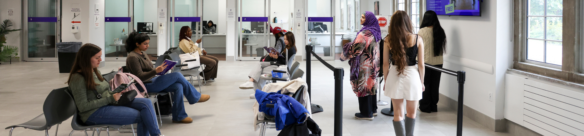 People waiting in the Thames Hall clinic.