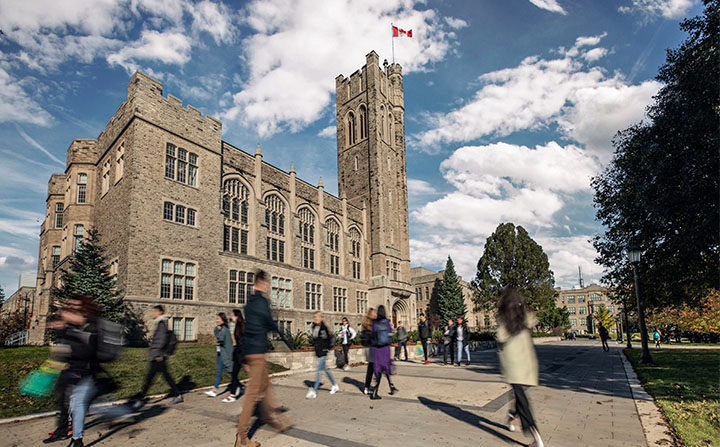 People walking in front of UC Tower