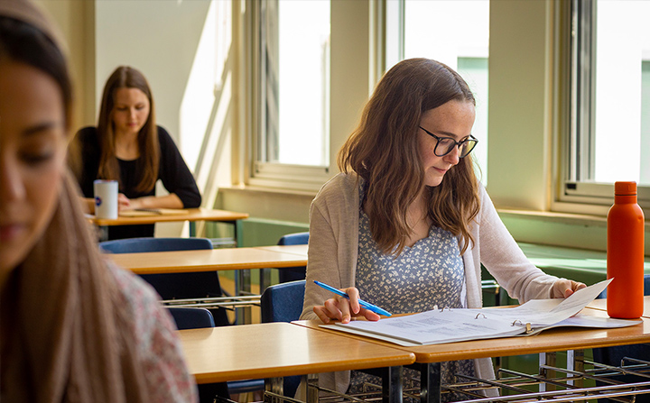 Students sitting in a classroom studying