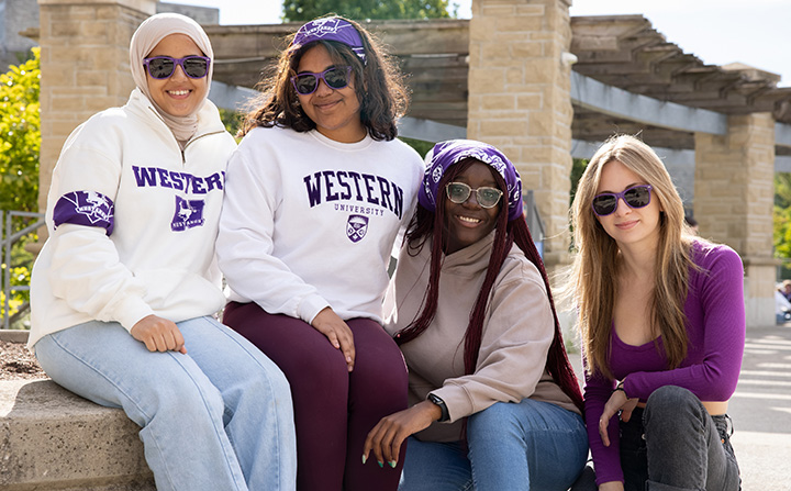 Group of female students wearing Western sweaters