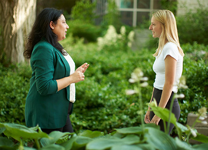 Staff speaking together outdoors