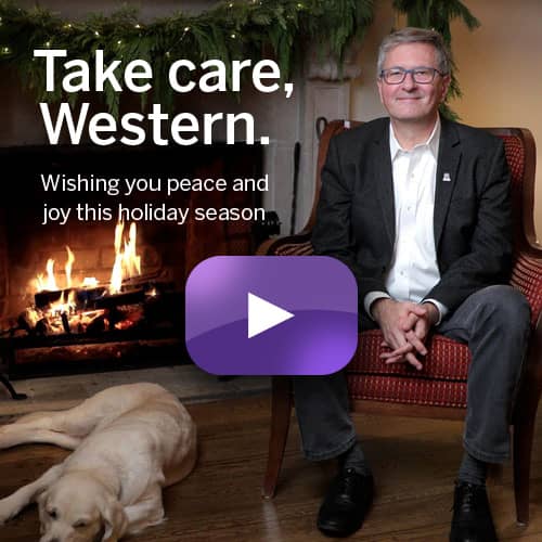 Alan Shepard's by the fireplace with dog Meisha