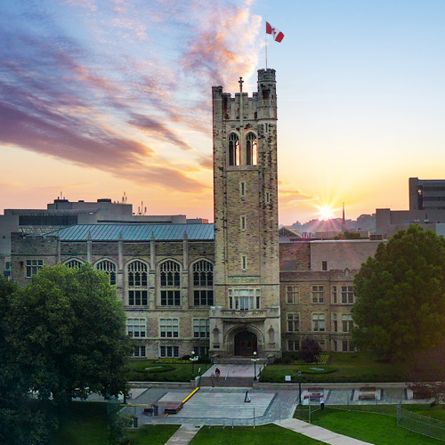 Western's gothic-style University College tower with the sun setting behind the building