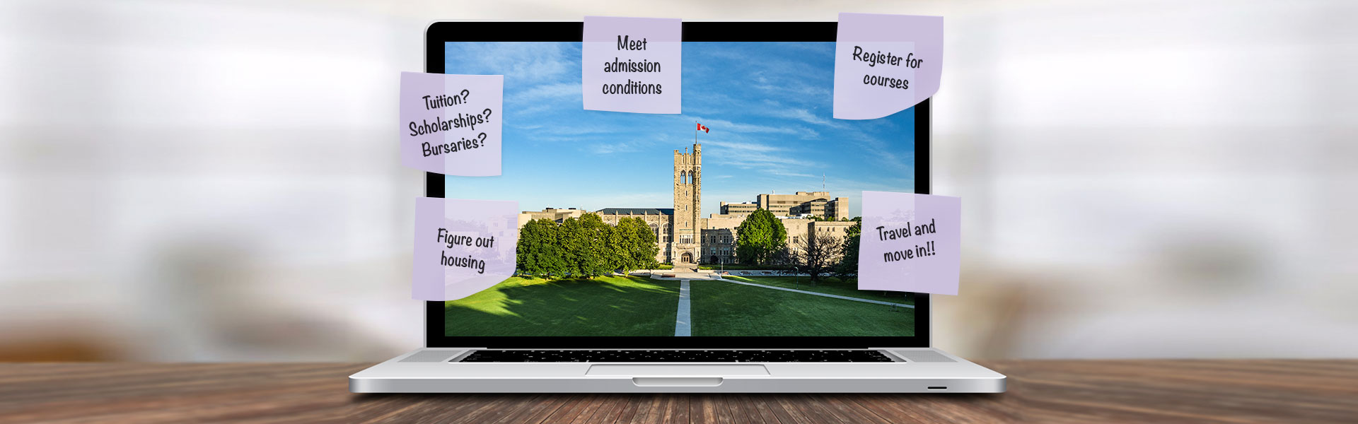 Laptop on desk showing a campus image with sticky note reminders related to starting university