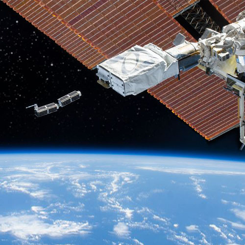 Photo of CubeSat mini-satellite in space