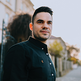 Male outside wearing green oxford shirt