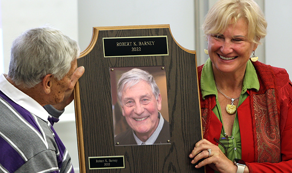 Bob Barney and Angela Schneider hold the plague for the Robert K. Barney Lecture
