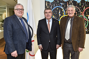 R. Barney and S. Wenn with IOC President Bach